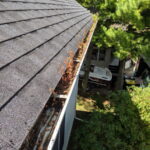 Gutters on a house full of leaves - Class Act Glass Best Window Cleaning Services in Mankato and Southern Minnesota